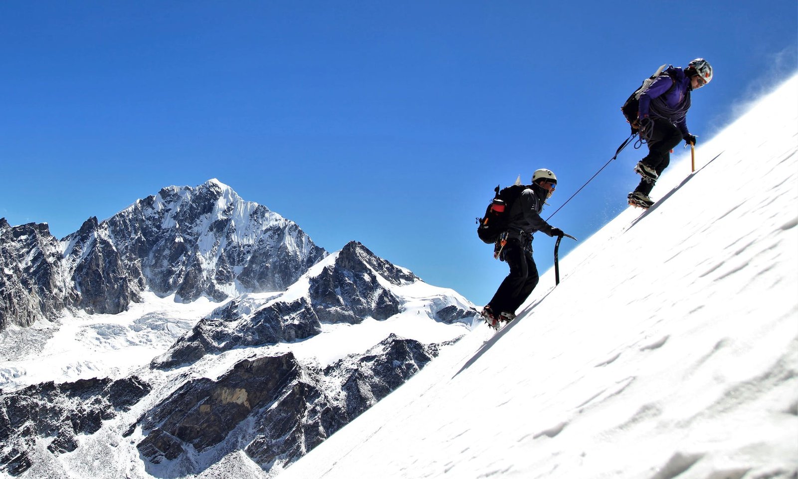 men hiking a snow covered mountain-work/life balance