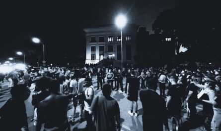 grayscale photo of protesters on a street