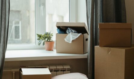 brown cardboard box on white bed